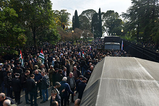 Protesters light a fire in the courtyard of the President of Abkhazia